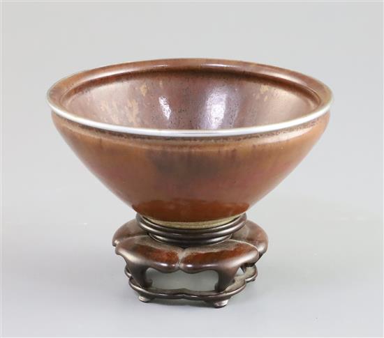 A Chinese Jian or Chayang ware bowl, Song dynasty, D. 12.6cm, wood stand